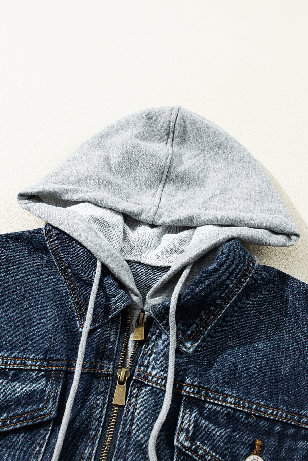 Distressed fake two-piece hooded zip-up denim jacket with buttoned pockets and drawstring.
