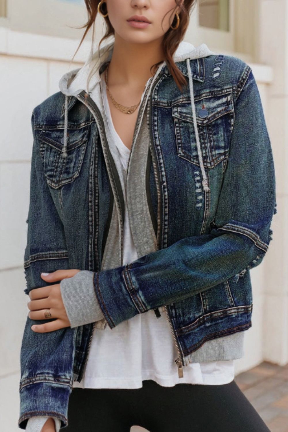 Distressed fake two-piece hooded zip-up denim jacket with buttoned pockets and drawstring.