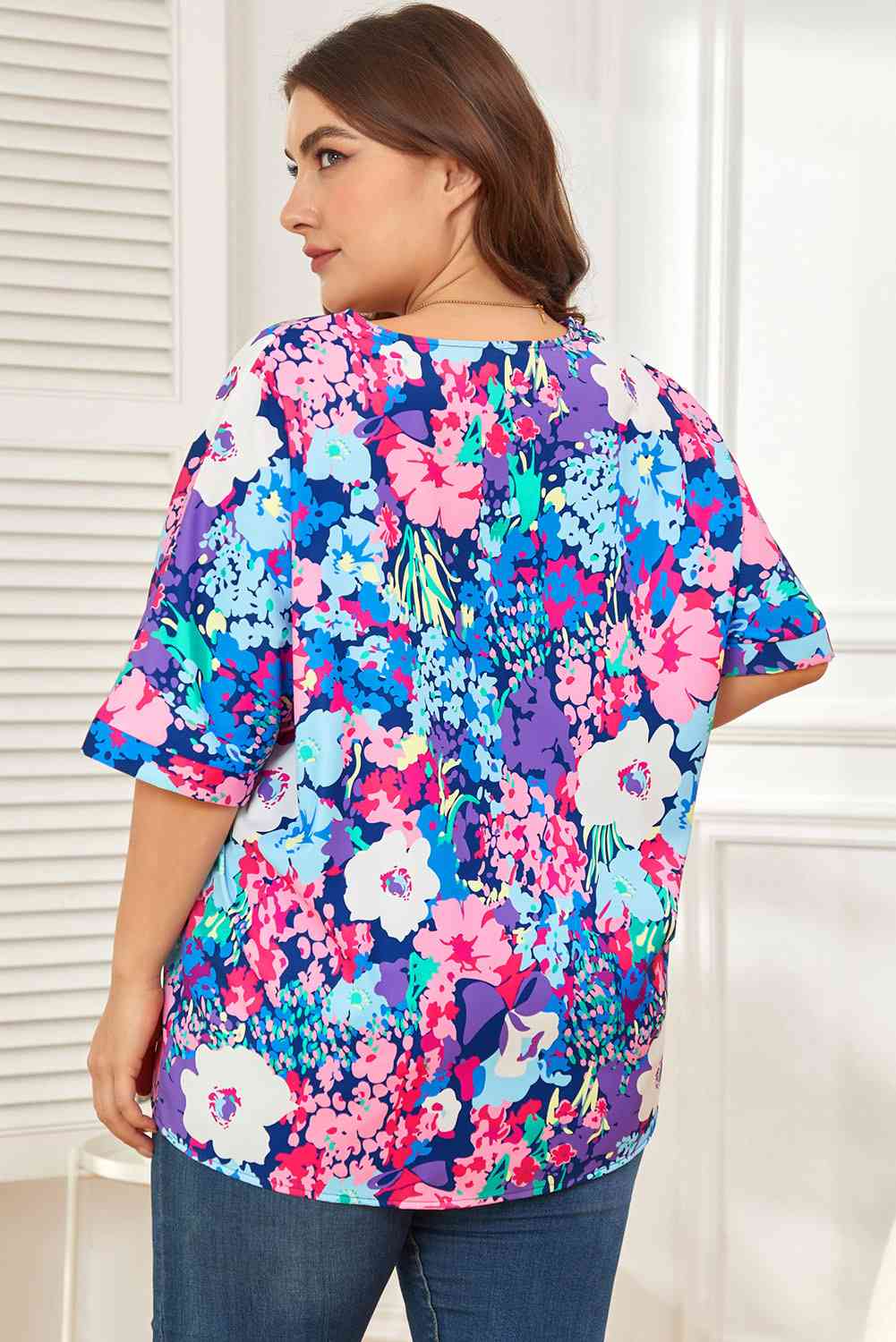 Floral center seam V-neck blouse.