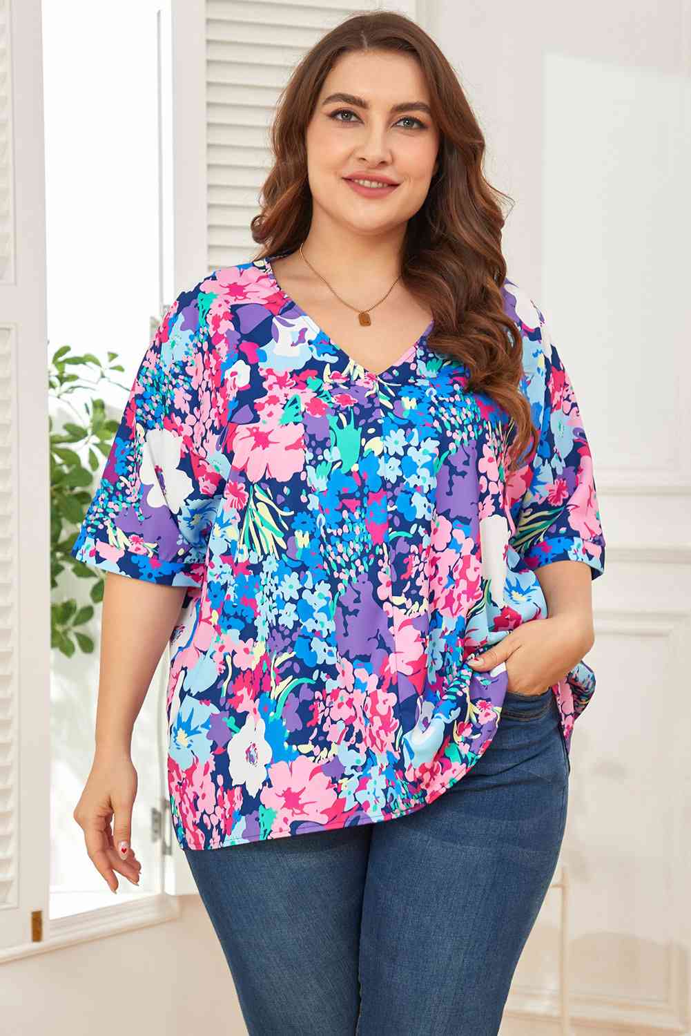 Floral center seam V-neck blouse.