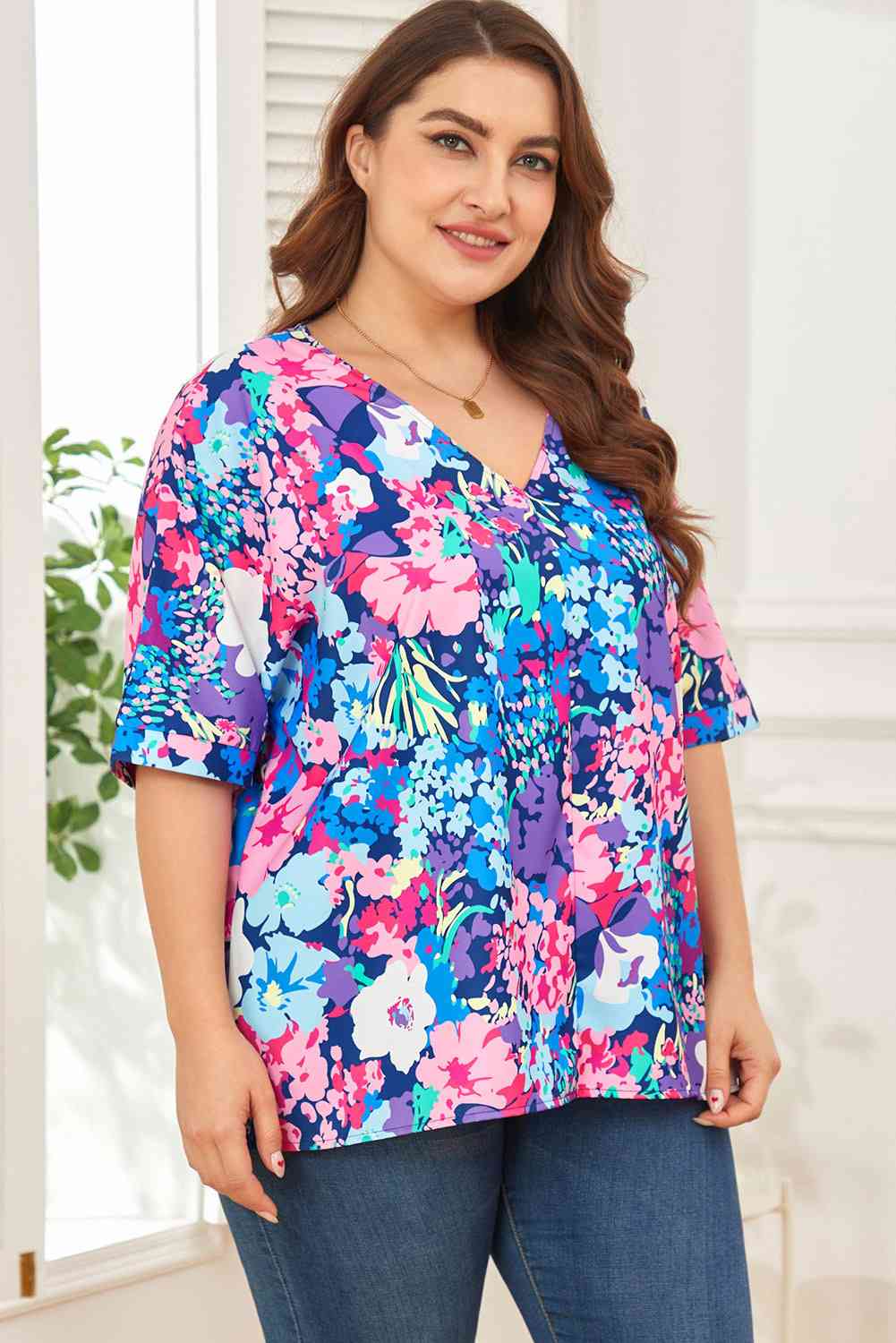 Floral center seam V-neck blouse.