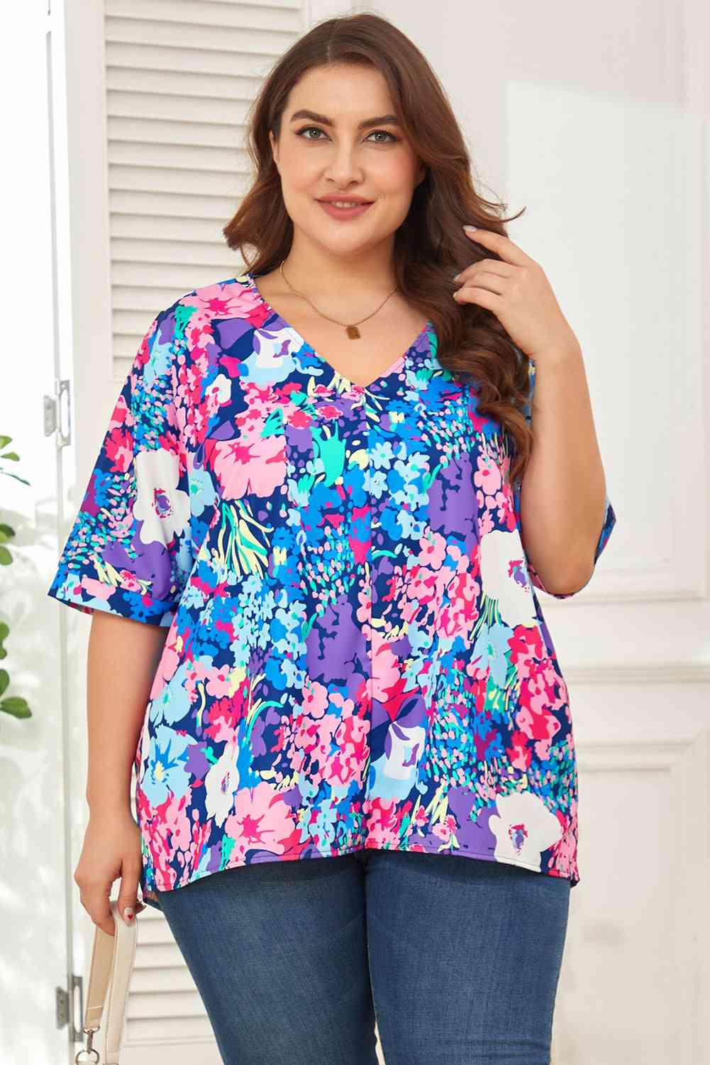Floral center seam V-neck blouse.