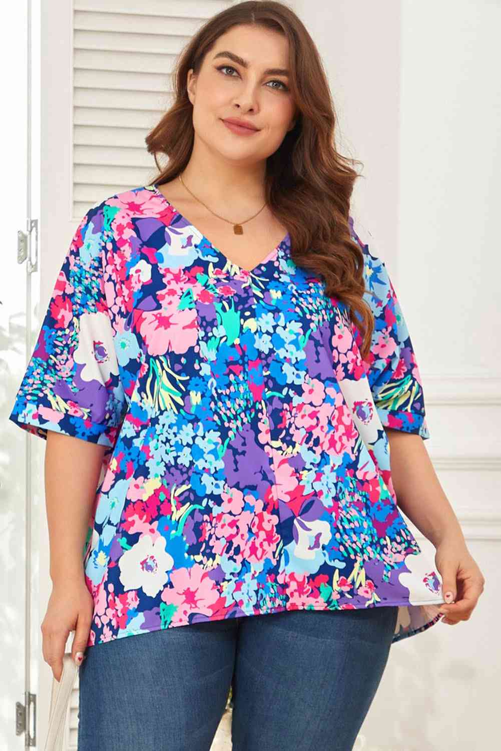 Floral center seam V-neck blouse.