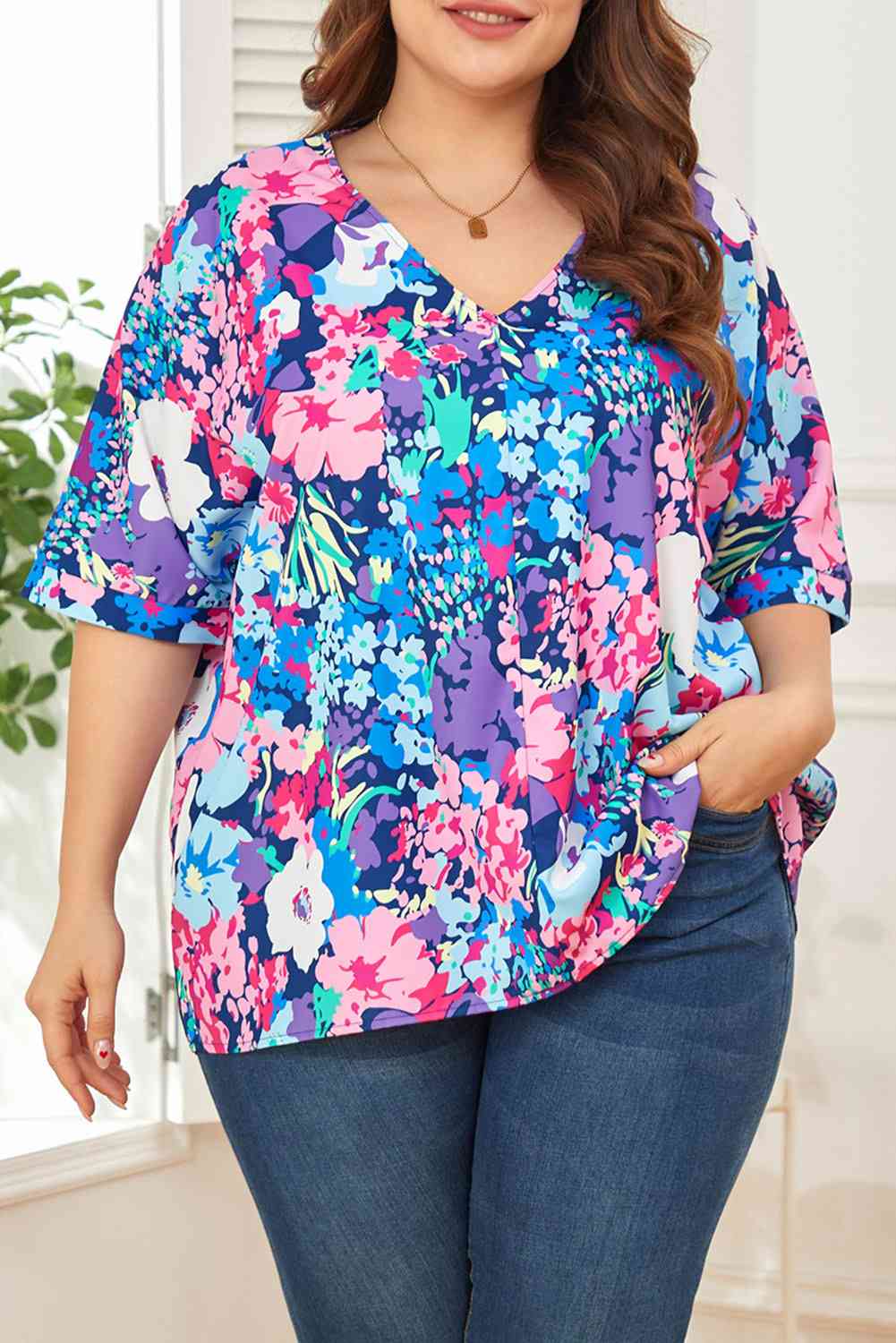 Floral center seam V-neck blouse.