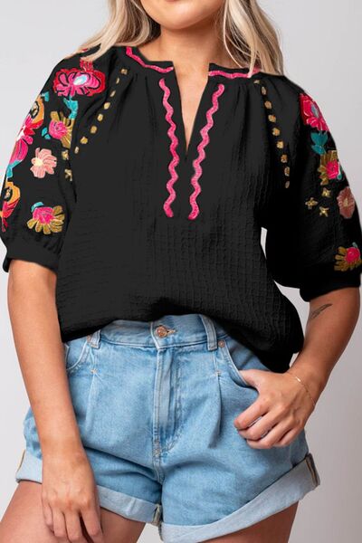 Floral embroidered notched puff sleeve blouse.