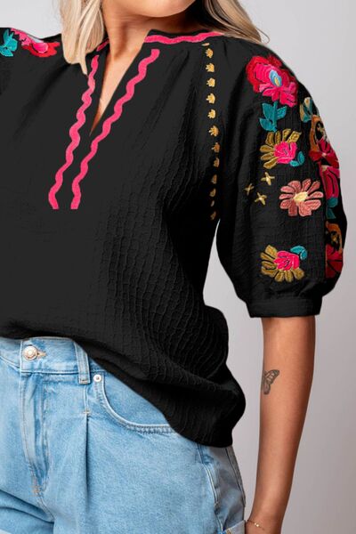 Floral embroidered notched puff sleeve blouse.