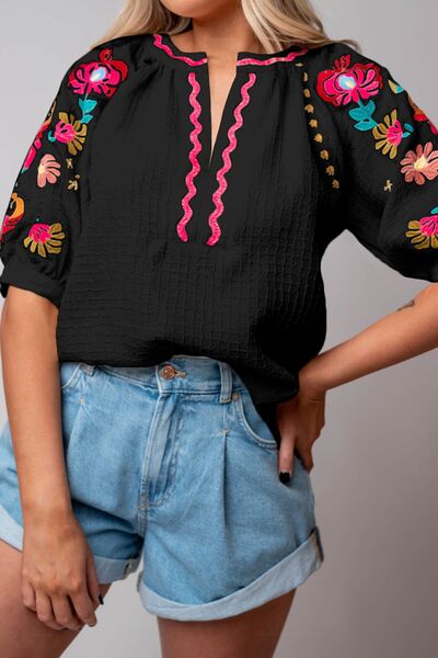 Floral embroidered notched puff sleeve blouse.