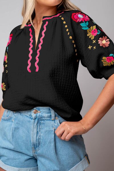 Floral embroidered notched puff sleeve blouse.