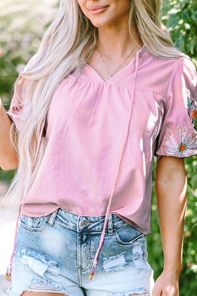 Floral embroidered puff sleeve blouse.