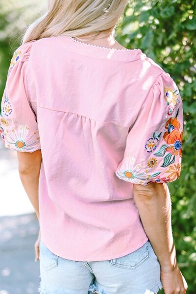 Floral embroidered puff sleeve blouse.
