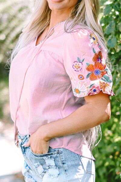 Floral embroidered puff sleeve blouse.