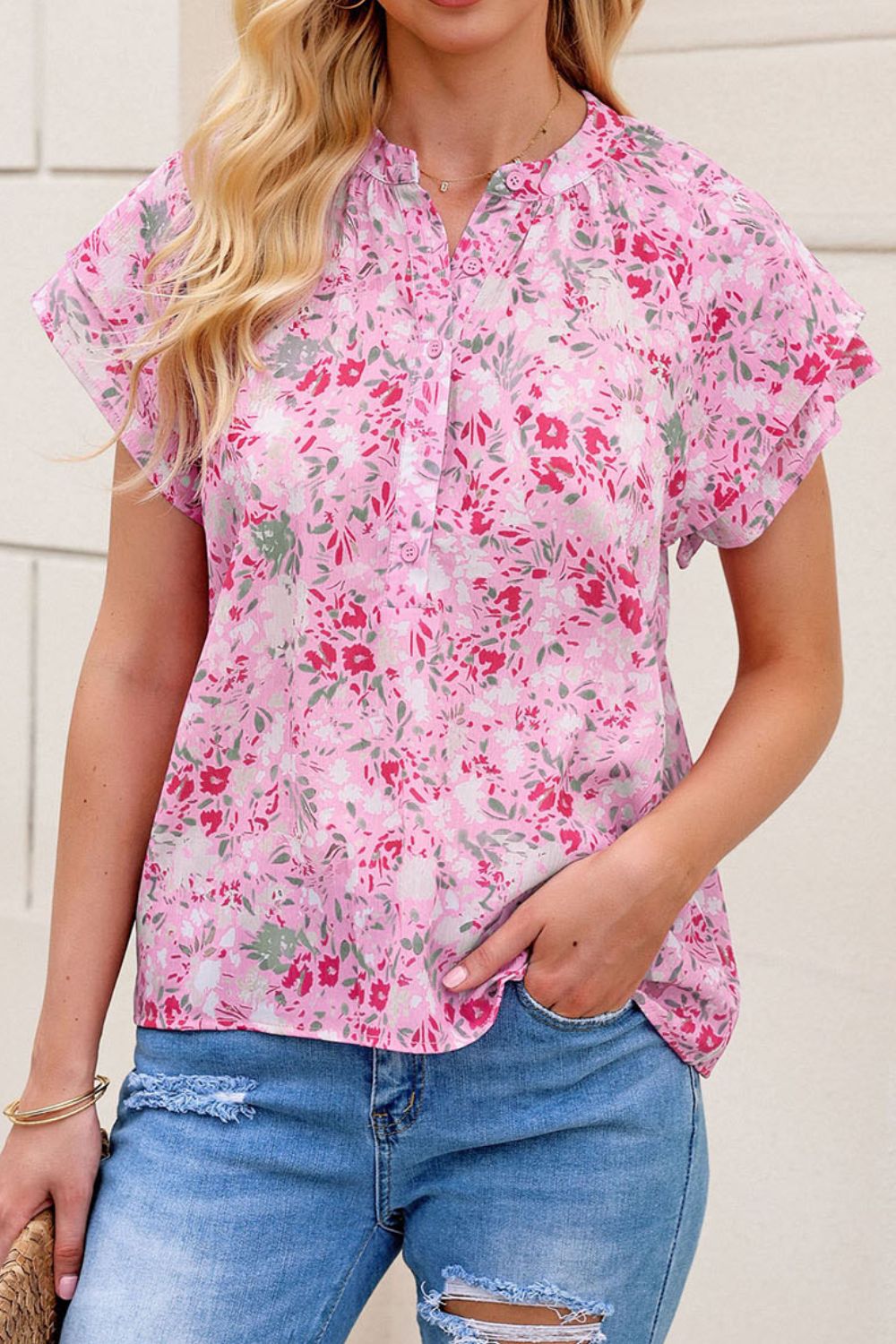 Floral half button round neck short sleeve blouse.