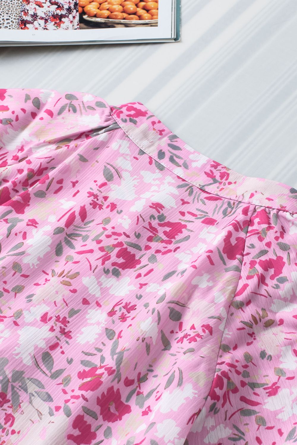 Floral half button round neck short sleeve blouse.