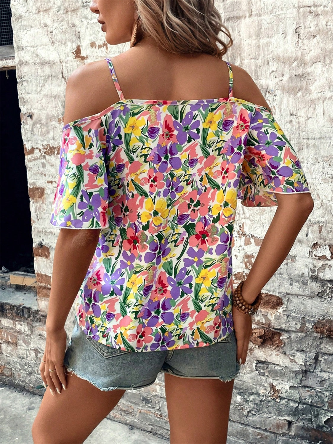 Floral half sleeve blouse.