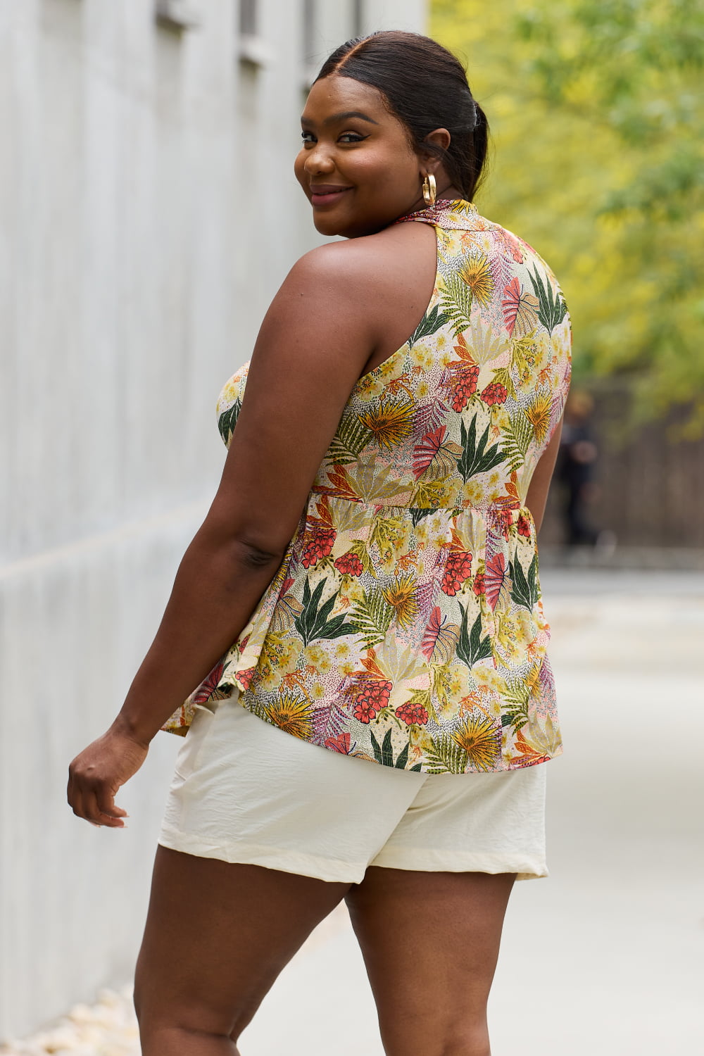Full size floral halter top in green, slightly stretchy.