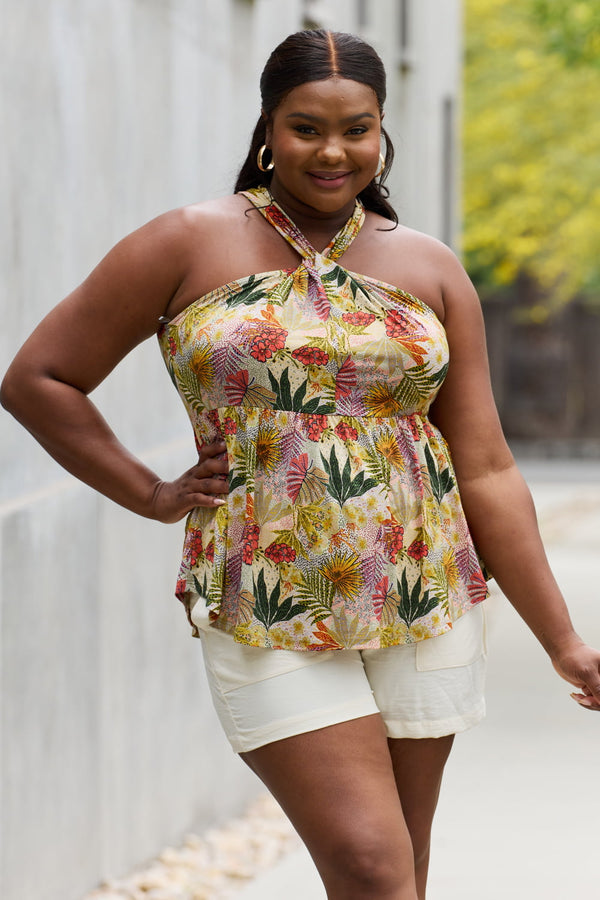 Full size floral halter top in green, slightly stretchy.