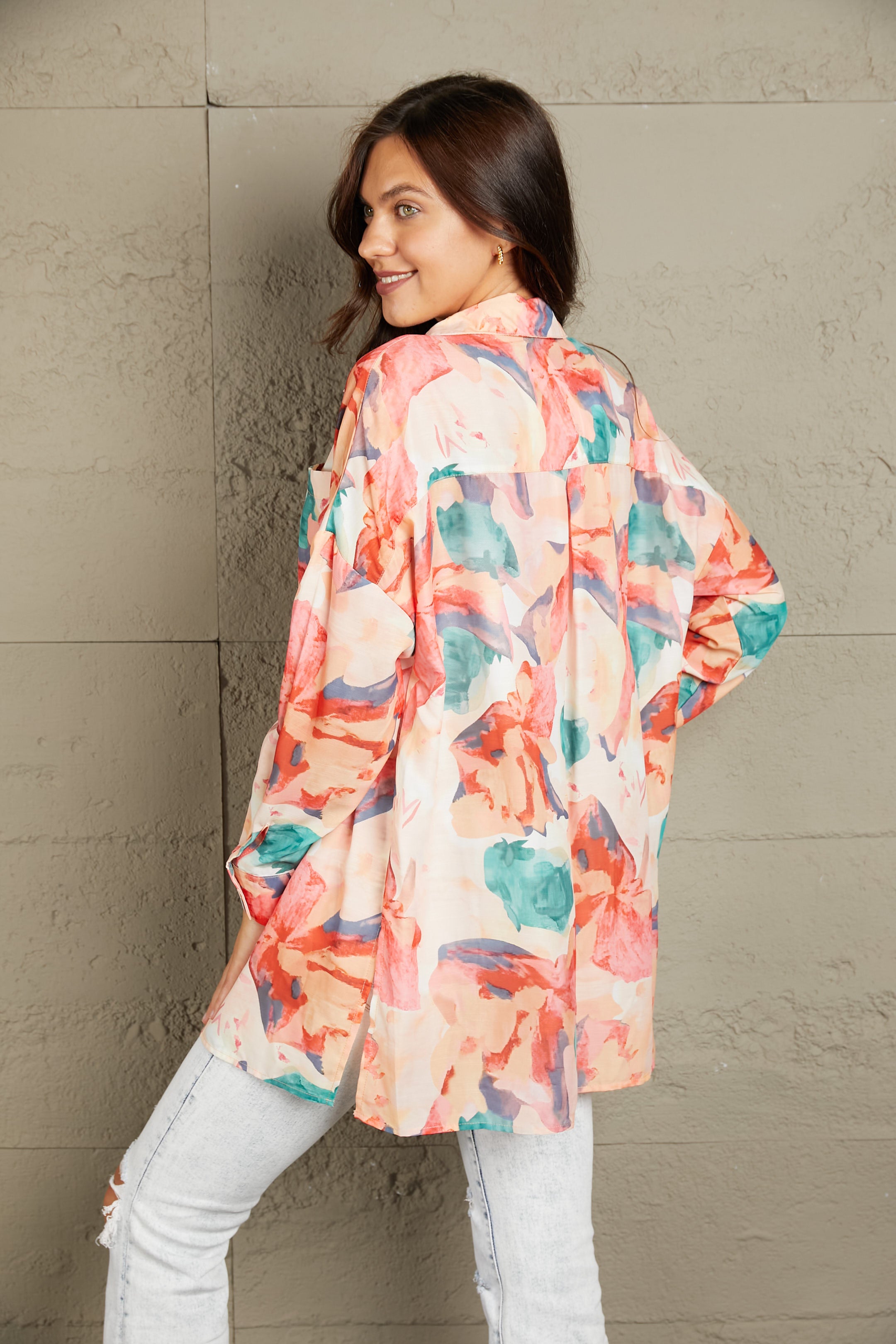 Floral long sleeve slit longline shirt with pockets.