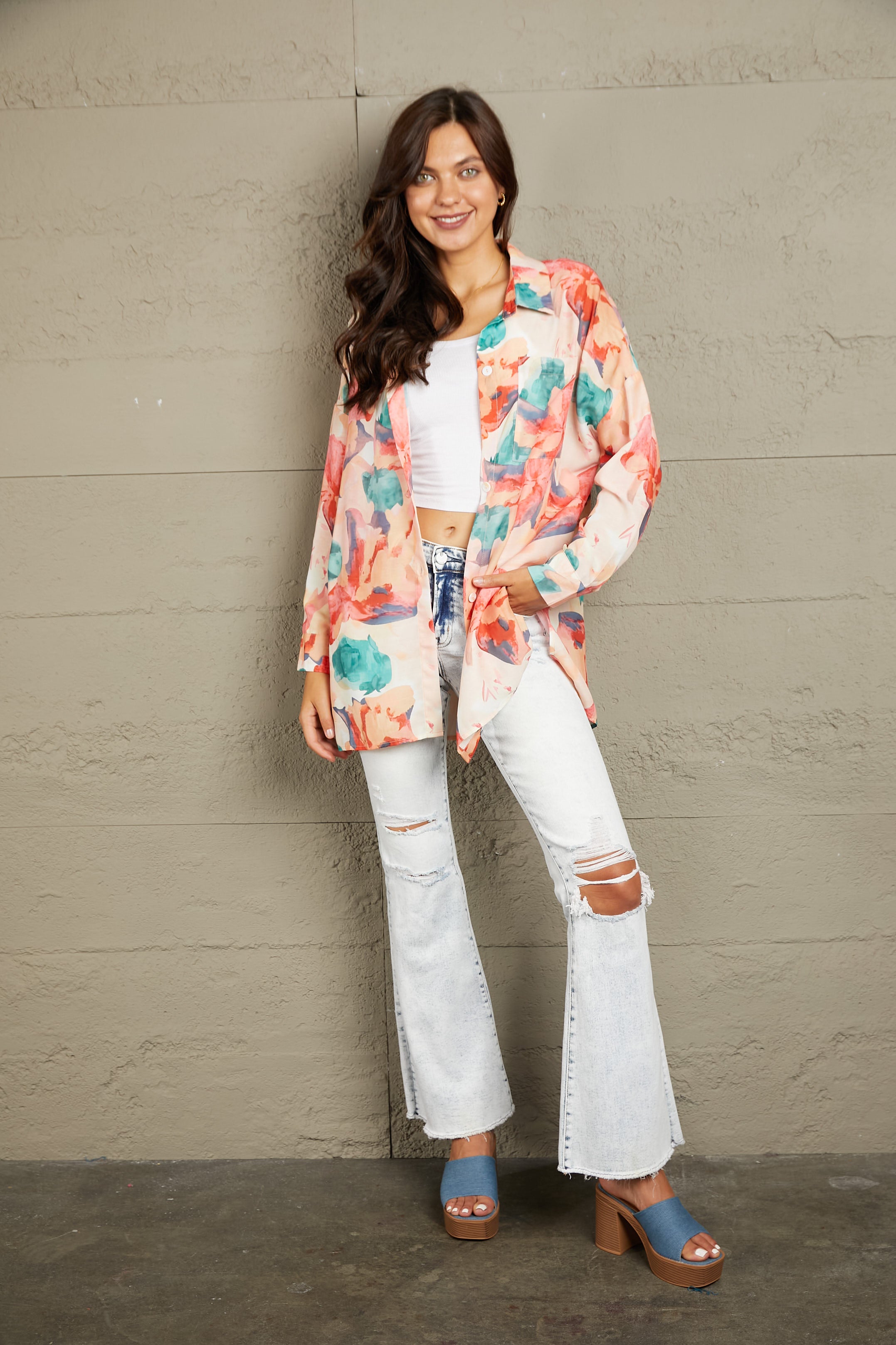 Floral long sleeve slit longline shirt with pockets.