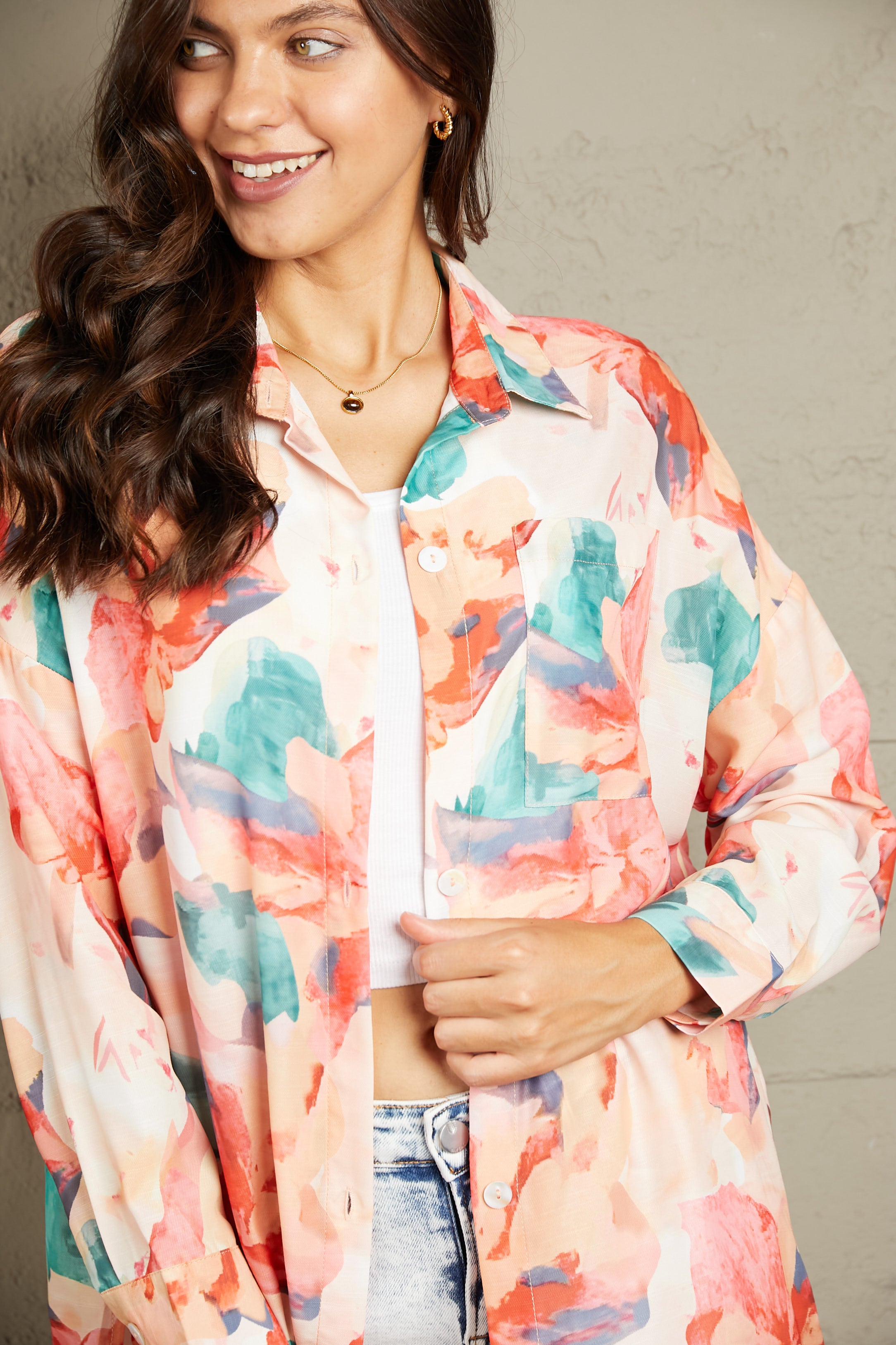 Floral long sleeve slit longline shirt with pockets.