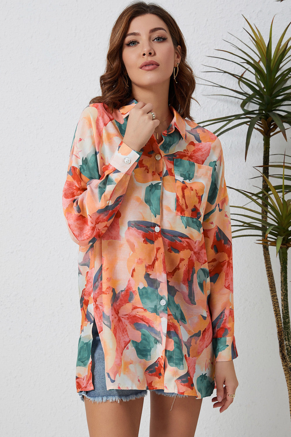Floral long sleeve slit longline shirt with pockets.
