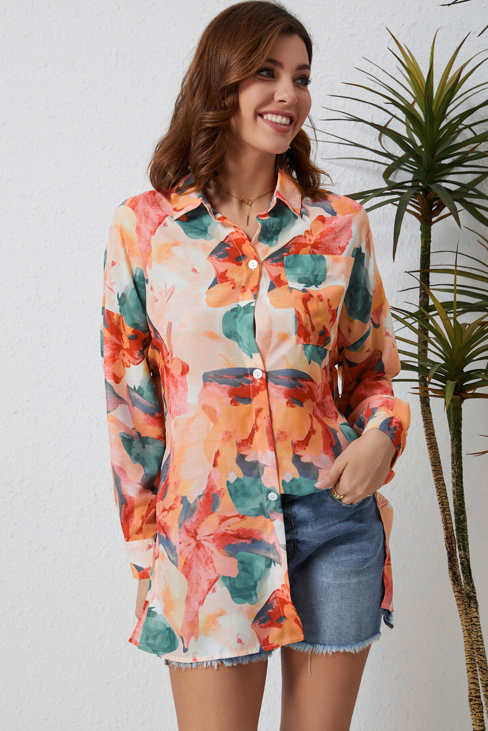 Floral long sleeve slit longline shirt with pockets.