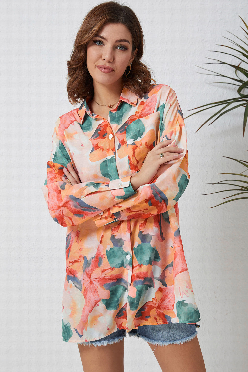 Floral long sleeve slit longline shirt with pockets.
