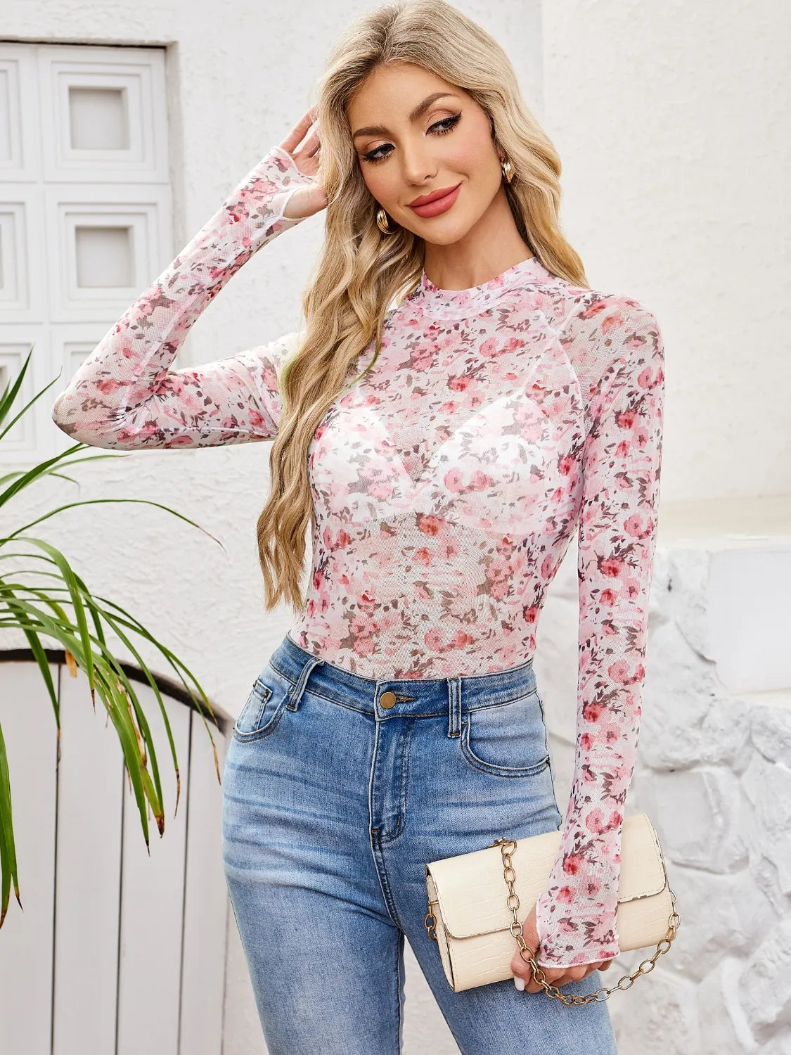 Floral mock neck long sleeve top.