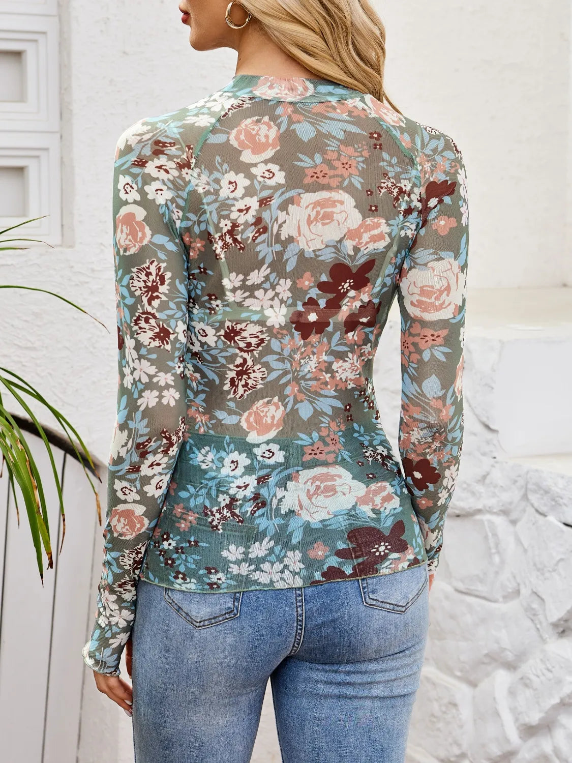 Floral mock neck long sleeve top.