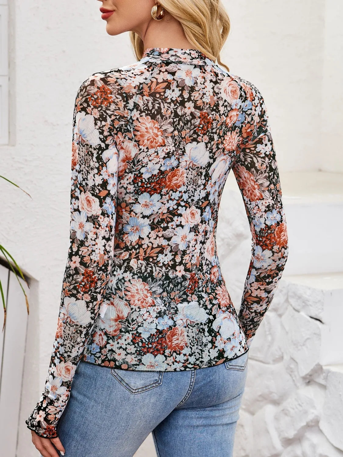 Floral mock neck long sleeve top.