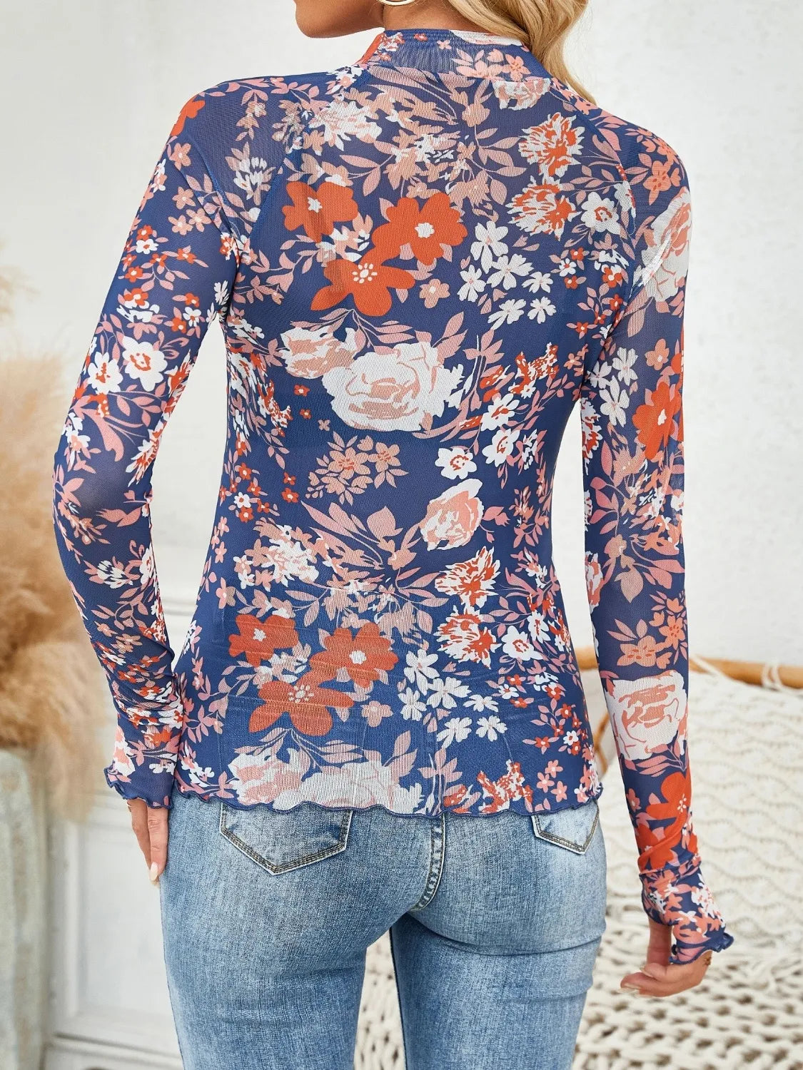 Floral mock neck long sleeve top.