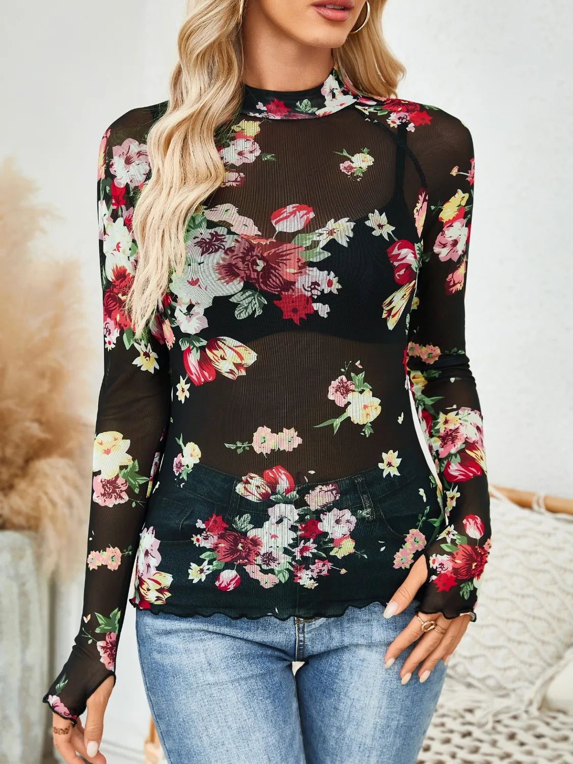 Floral mock neck long sleeve top.