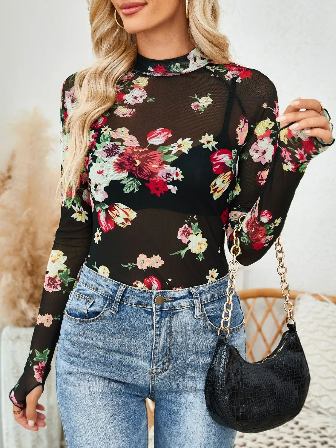 Floral mock neck long sleeve top.