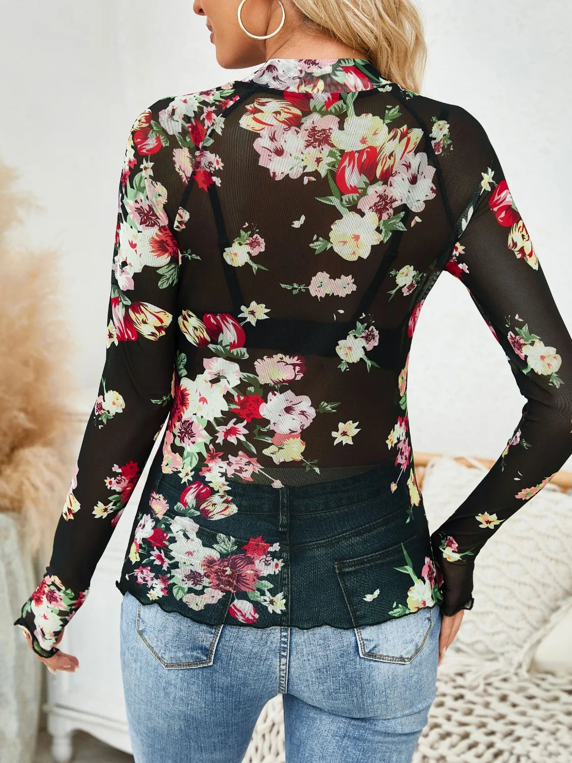 Floral mock neck long sleeve top.
