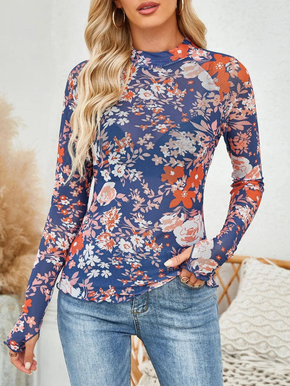Floral mock neck long sleeve top.