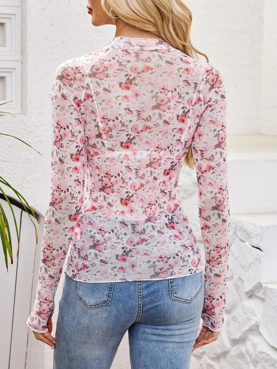 Floral mock neck long sleeve top.