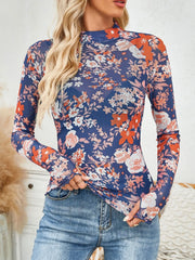 Floral mock neck long sleeve top.