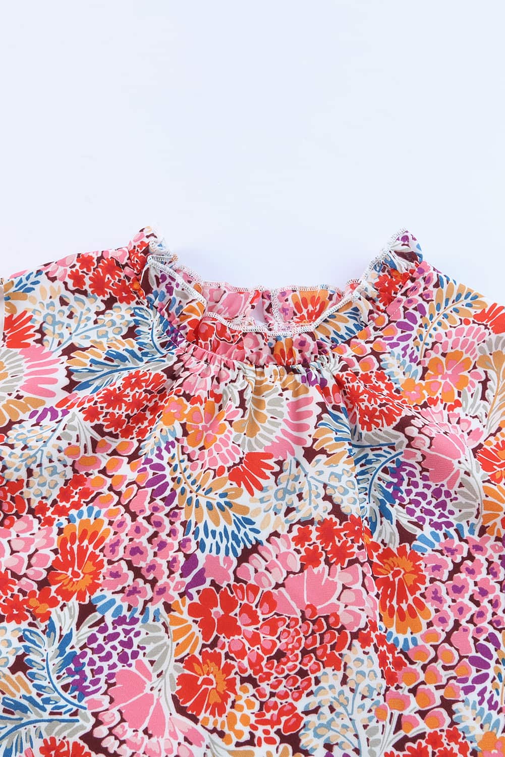 Floral print mock neck tank top.