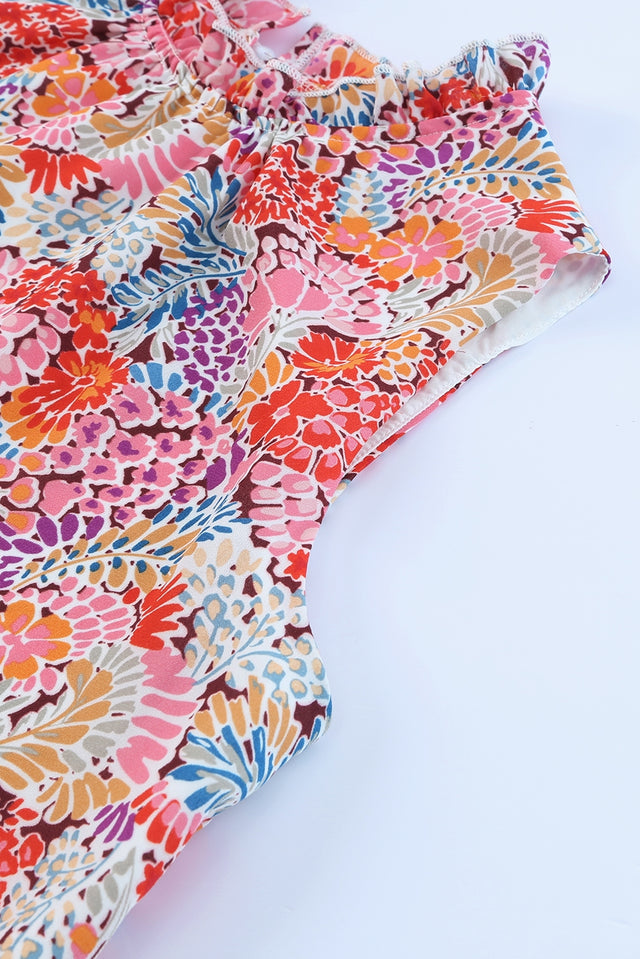 Floral print mock neck tank top.