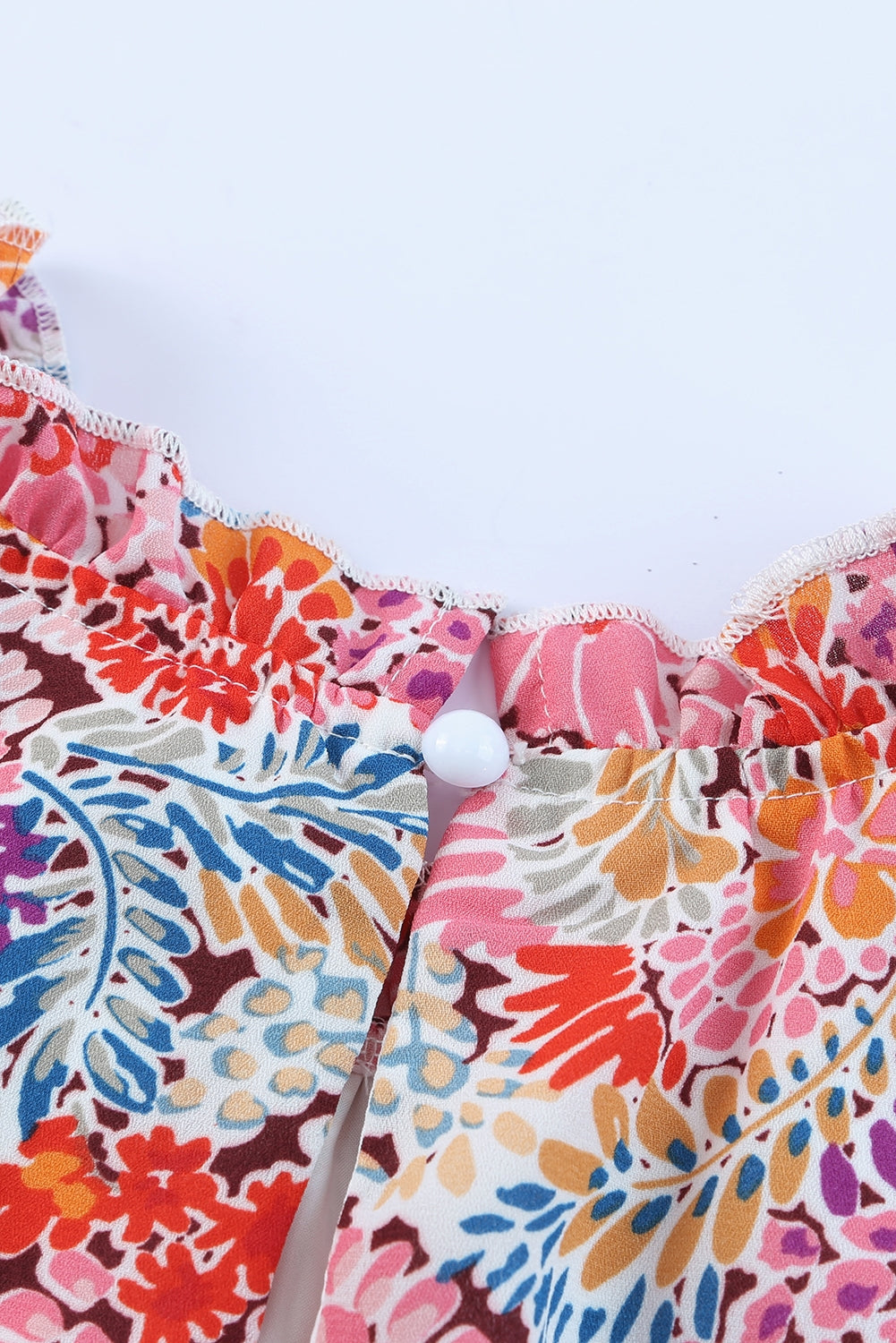 Floral print mock neck tank top.