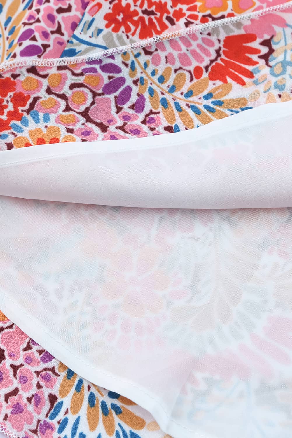 Floral print mock neck tank top.