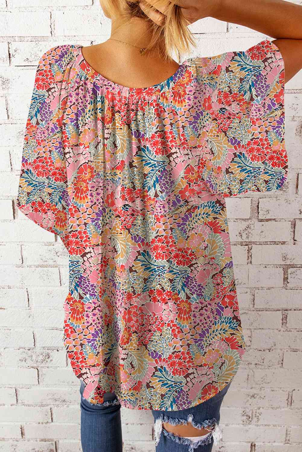 Floral notched neck flutter sleeve blouse.