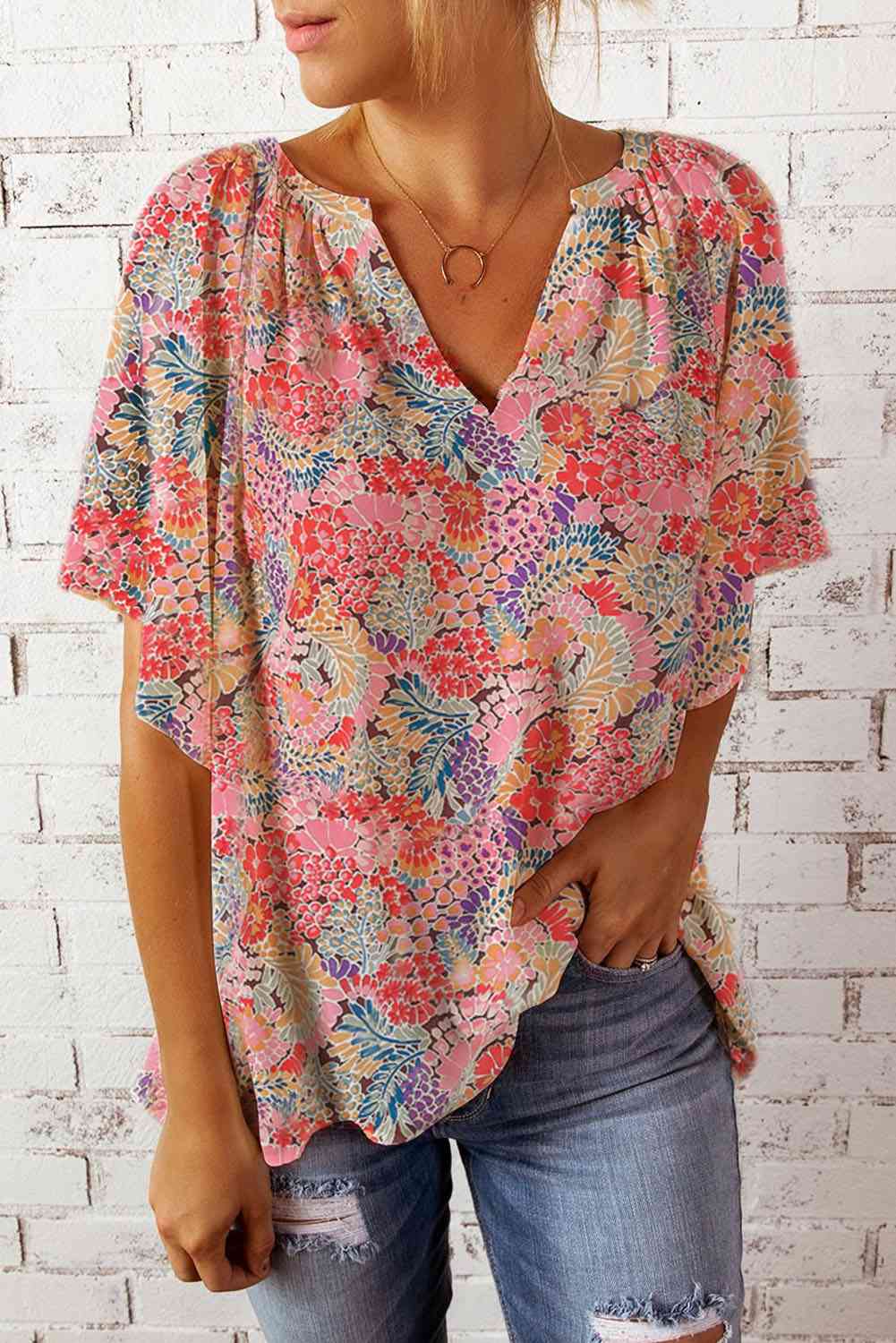 Floral notched neck flutter sleeve blouse.