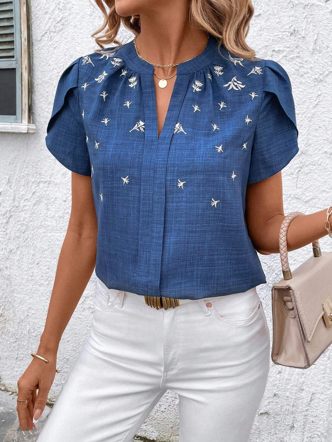 Floral notched short sleeve blouse.