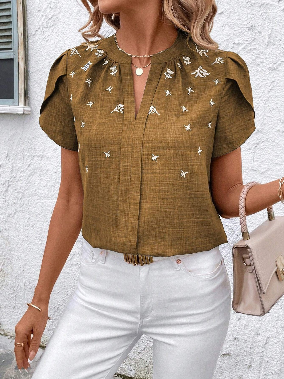 Floral notched short sleeve blouse.