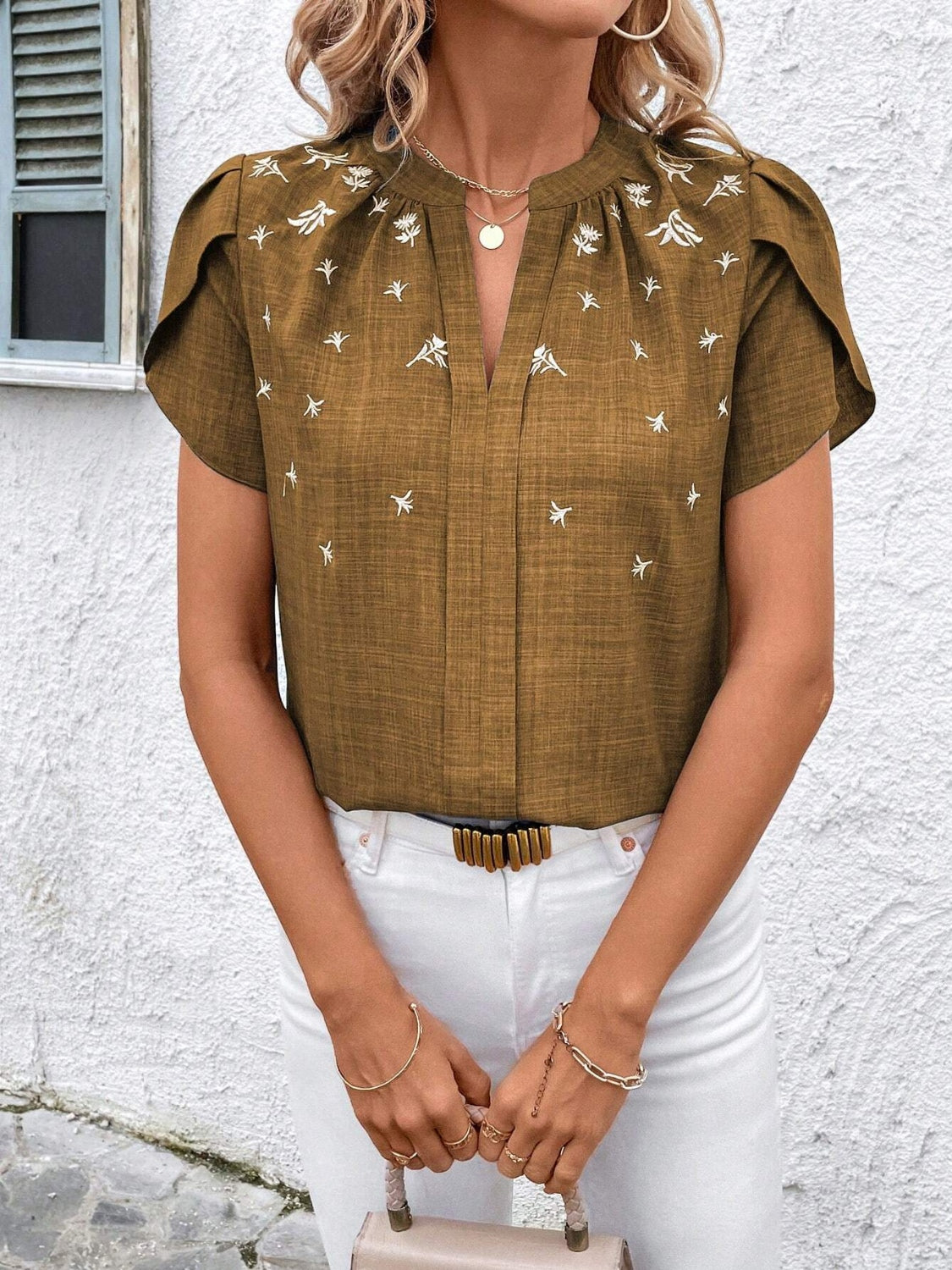 Floral notched short sleeve blouse.