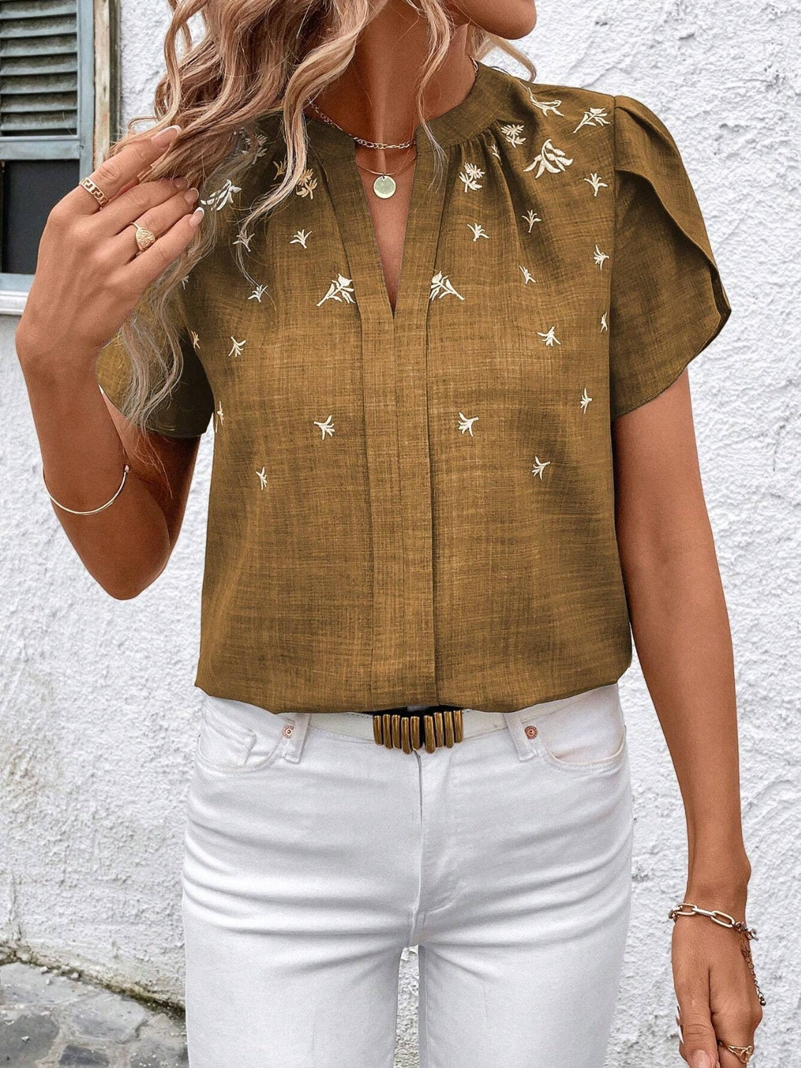 Floral notched short sleeve blouse.