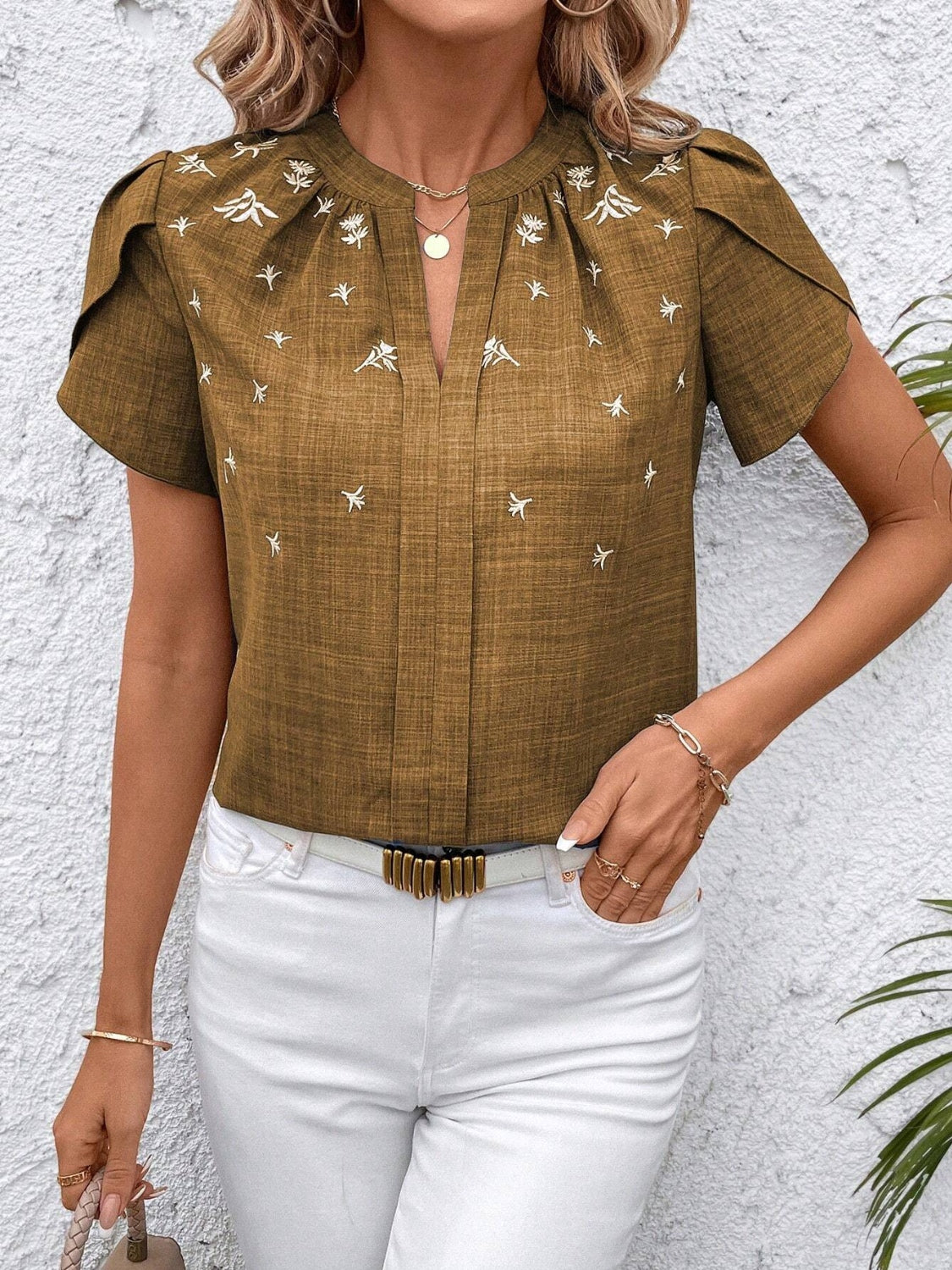 Floral notched short sleeve blouse.