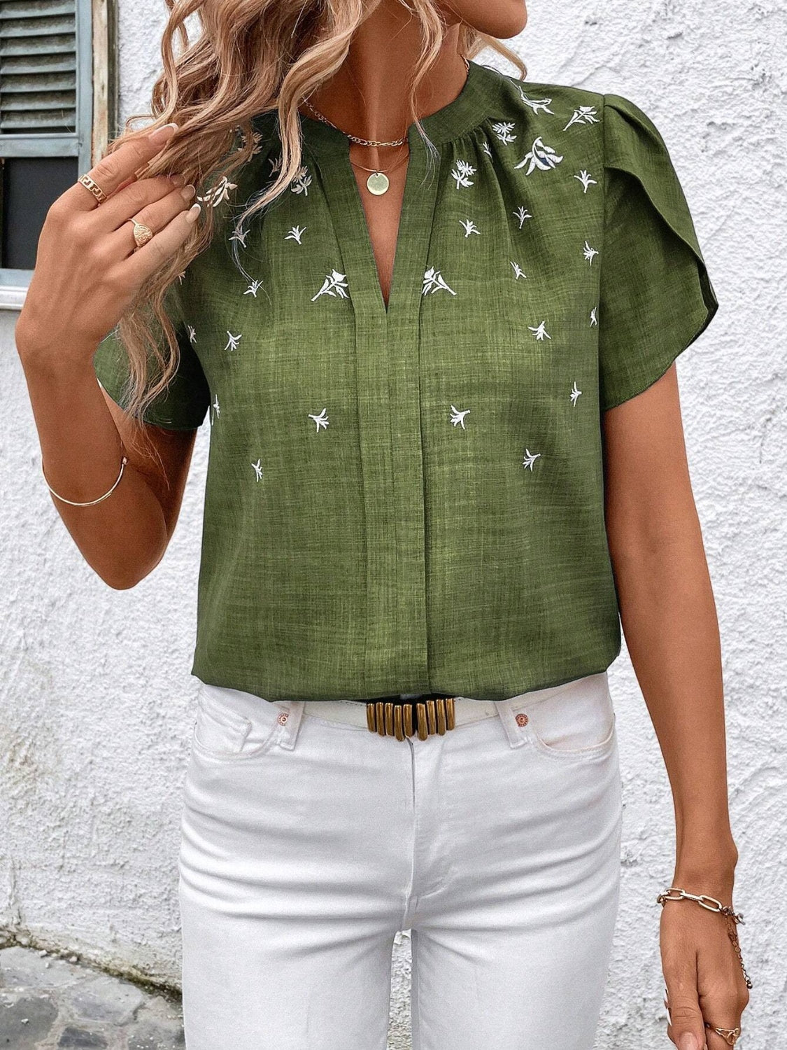 Floral notched short sleeve blouse.