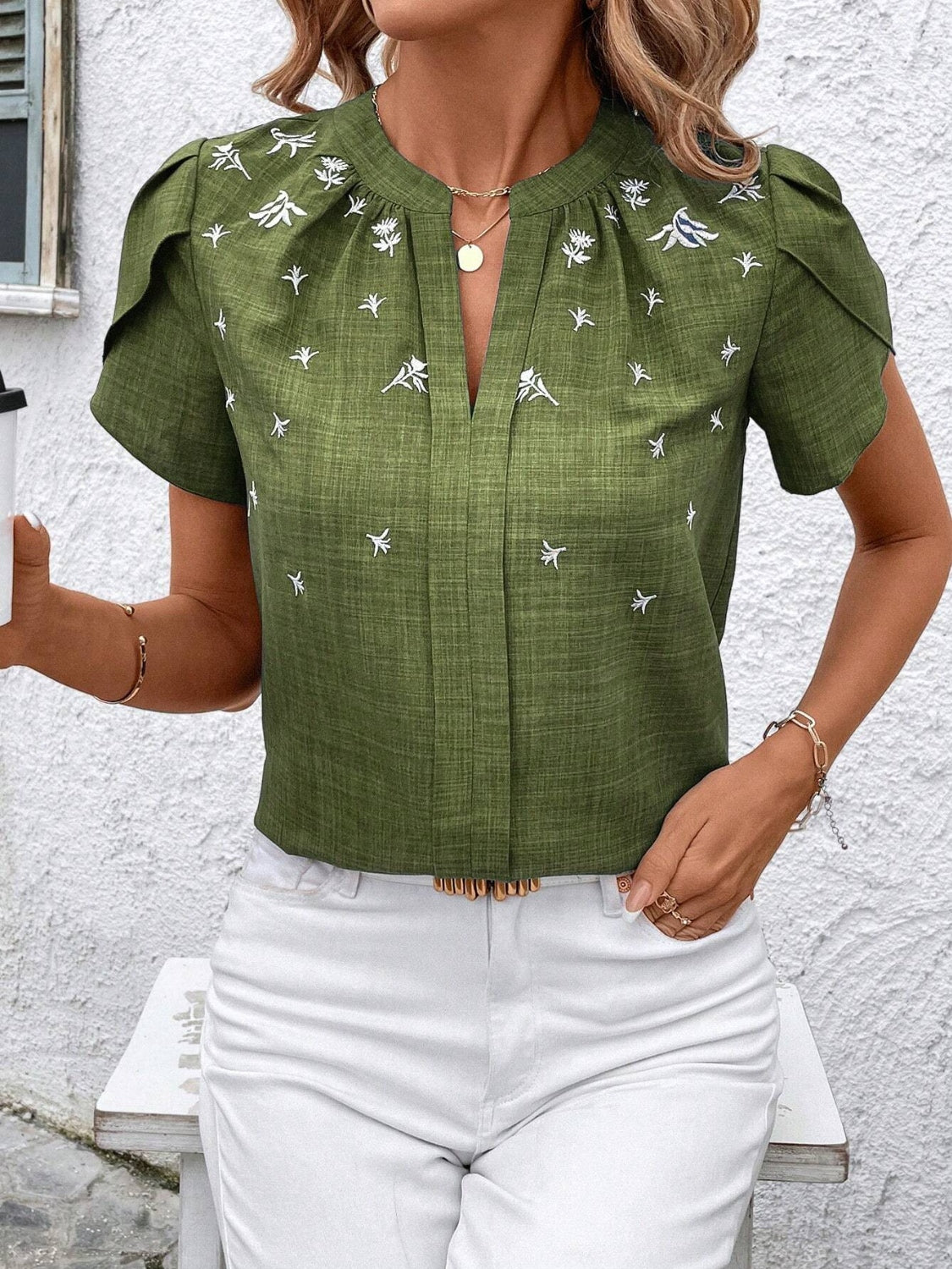 Floral notched short sleeve blouse.