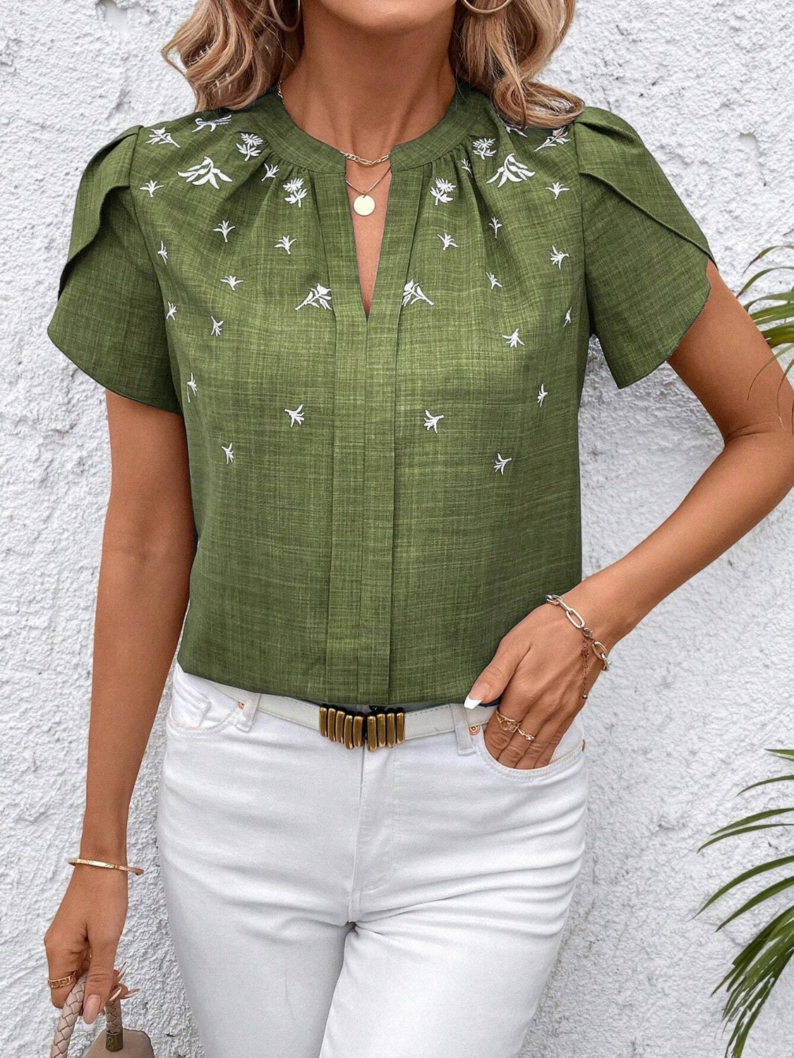Floral notched short sleeve blouse.